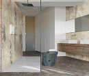 Łazienka z białymi umywalkami i kabiną prysznicową ze ścianą imitującą kamień Florim Creative Design Onyx&More Golden Blend