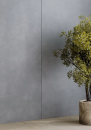 Ściana z płytkami imitującymi beton, w kolorze szarym, w matowym wykończeniu Paradyż Ceramika Architeq Graphite Mat