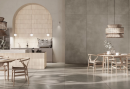 Restauracja w nowoczesnym stylu z ozdobnymi beżowymi cegiełkami na ścianie i ladzie, drewnianymi stolikami i krzesłami oraz płytkami imitującymi beton, w kolorze jasno brązowym, w matowym wykończeniu Paradyż Ceramika Architeq Light Brown Mat