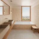 Płytka dekoracyjna ścienna Gayafores Deco Biscuit Cream 32x62,5 wyłożona na ścianach oraz obudowie wanny w przestronnej łazience. Drewniany podwieszany blat z umywalkami, baterie podtynkowe i duże lustro