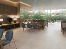 Wnętrze restauracji z kremowymi płytkami podłogowymi imitującymi beton Porcelanosa Vela Natural