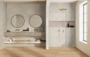 Łazienka z podwójną umywalką i złotym prysznicem, płytki Marazzi Limestone Wall Taupe 3D Mikado na ścianie tworzą spójną i harmonijną całość