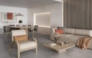 Nowoczesny duży salon z jadalnią w której znajduje się drewniany stół razem z krzesłami, na ścianie położone są płytki Halcon Amira Bone Evolution Mat 60x120. W części salonowej znajduje się jasny wypoczynek z drewnianym stolikiem