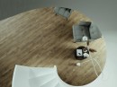 Gresowa płytka imitująca brązowe drewno Stargres Taiga Wood Honey 30x120 w wykończeniu powierzchni lappato na podłodze w salonie z szarym wypoczynkiem oraz białymi schodami