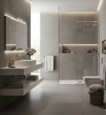 Łazienka o spokojnym i eleganckim designie, z miękkim, rozproszonym oświetleniem, które podkreśla subtelne wariacje w kolorze i teksturze płytek Marazzi Slow Argilla 60x60 cm MFRS