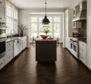 owoczesna kuchnia z ciemnobrązowymi płytkami drewnopodobnymi Marazzi Vivo Castano Chevron 11x54 cm MP3R ułożonymi w jodełkę na podłodze, widoczna z perspektywy wejścia, z centralną wyspą i białymi szafkami