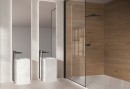 Płytka gresowa, podłogowa imitująca drewno w kolorze brązowym, wykończenie powierzchni matowe, Mykonos Couvet Wood Roble Soft Rect. 75x150 położona na ścianie pod prysznicem w łazience gdzie znajdują się jeszcze dwie wolnostojące umywalki