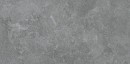 Antracytowa, prostokątna płytka ceramiczna w formacie 60x120 cm z kolekcji Marazzi Mystone Pietra Ligure, płytka posiada matowe wykończenie i wiernie imituje ciemny kamień naturalny, prezentując nieregularną fakturę z subtelnymi jasnymi użyleniami