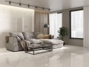 Płytka gresowa, podłogowa imitująca kamień w białym kolorze, wykończenie powierzchni w połysku, Pamesa Dolomite Bianco Polished 30x60 położona na podłodze i ścianie w salonie gdzie znajduje się jasny wypoczynek oraz okna z widokiem na miasto