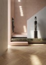 Eleganckie wnętrze prezentuje podłogę wyłożoną płytkami gresowymi Marazzi Nobilis Chevron Noce Naturale 11x54 cm MQ96, które wiernie imitują naturalne drewno w klasycznym układzie jodełki francuskiej