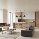 Nowoczesny, jasny salon połączony z kuchnią, urządzony w minimalistycznym stylu z wykorzystaniem drewna, bieli i beżowych płytek wielkoformatowych Marazzi Resin Avana 120x120 cm MQP3, centralny punkt stanowi szara sofa oraz wyspa kuchenna