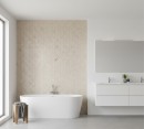 Mozaika dekoracyjna, imitująca kamień w beżowym odcieniu, Lantic Colonial Herringbone Dorcia Marfil 26x28 100351895 położona na ścianie w łazience z dużą białą wanną oraz białymi szafkami