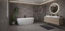 Nowoczesna łazienka wykończona ciemnoszarymi płytkami Marazzi Room Antracite, które imitują kamień na ścianach i podłodze, wnętrze wyposażono w białą wolnostojącą wannę, drewnianą szafkę podumywalkową oraz okrągłe podświetlane lustro