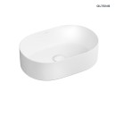 Owalna biała umywalka nablatowa Oltens Lom Thin 40827000 z powłoką SmartClean 45x30 z białym korkiem