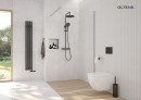 Oltens Vernal elegancka miska WC wisząca PureRim w zestawie z deską wolnoopadającą 42006000 Nowoczesna miska WC wisząca o designerskim charakterze w jasnej łazience z prysznicem oraz dużym oknem