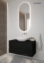 Łazienka z podświetlanym owalnym lustrem, czarną wiszącą szafką i białą nablatową umywalką Oltens Sogne 63x42cm