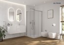 Oltens Vernal bidet ceramiczny wiszący z powłoką SmartClean w klasycznej bieli 46502000 Stylowy, biały bidet montowany na stelażu podtynkowym zamontowany w łazience z drewnianą podłogą oraz prysznicem. Brak baterii w zestawie