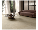 Salon  wykończony gresem Ceramiche Italiane Blok Beige 60x60. Ciepłe, beżowe płytki o strukturze betonu tworzą przytulną i trwałą nawierzchnię. Matowe wykończenie oraz rektyfikowane krawędzie zapewniają nowoczesny wygląd strefy relaksu.