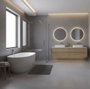 Nowoczesna łazienka wykończona matowymi, szaroniebieskimi płytkami wielkoformatowymi Marazzi Slow Cold Piombo 60x60 cm MPEK na ścianach i podłodze, wnętrze wyposażono w wolnostojącą wannę, dębową szafkę z dwiema umywalkami