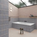 Płytka ścienna, dekoracyjna w niebieskim odcieniu, wykończenie powierzchni w połysku, Gayafores Deco Pottery Navy 32x62,5 położona na ścianie w łazience gdzie znajduje się duża wanna, taboret oraz półka na kosmetyki