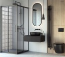 Łazienka z kabiną prysznicową, owalnym podświetlanym lustrem, czarną armaturą, wiszącą szafką i umywalką nablatową Oltens Hamnes Thin