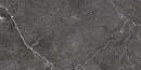 Gres Blustyle Unica Carbon 60x120 w głębokim, antracytowym odcieniu z wyrazistymi, jasnymi żyłkami. Matowa powierzchnia o strukturze kamienia nadaje wnętrzom luksusowy i zdecydowany charakter. Idealny wybór do nowoczesnych, eleganckich aranżacji.