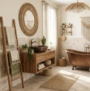 Gres Alaplana Gravina Beige Mate 120x120 na podłodze salonu. Beżowe płytki o wzorze lastryko tworzą spójną bazę dla nowoczesnej sofy i szklanego stolika. Duże przeszklenia i minimalistyczny design podkreślają przestronny, jasny charakter wnętrza.