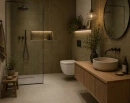 Nowoczesna łazienka w ciepłej, naturalnej stylistyce z płytkami Marazzi Confetto Kaki 10x10 cm MDSM na ścianach. Prysznic walk-in, drewniana szafka i subtelne oświetlenie tworzą przytulne, eleganckie wnętrze inspirowane naturą.