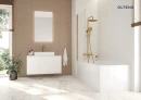 Oltens Nordlis lustro 60x100 cm prostokątne z oświetleniem od tyłu z matą grzewczą złoto szczotkowane 64120810 - lustro zawieszone na ścianie w łazience gdzie znajduje się duża wanna, biała szafka oraz umywalka