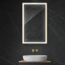 Oltens Nordlis lustro 60x100 cm prostokątne z oświetleniem z przodu z matą grzewczą złoty 64106800 - lustro zawieszone na ciemnej ścianie w łazience a pod nim znajduje się biała umywalka