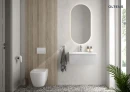 Oltens Nordlis lustro 50x100 cm owalne z oświetleniem od tyłu z matą grzewczą 64129000 - lustro zawieszone na ścianie w łazience gdzie znajduje się biała umywalka oraz wisząca miska WC