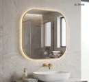 Oltens Nordlis lustro 80x80 cm kwadratowe z oświetleniem od tyłu z matą grzewczą złoto szczotkowane 64125810 - lustro zawieszone na ścianie w łazience gdzie znajduje się ciemna szafka oraz biała umywalka