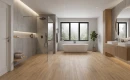 Keratile Haspe Roble 30x150 antypoślizgowa gresowa płytka imitująca jasne drewno z wyraźnymi słojami na podłodze łazienki w połączeniu z szarym betonem na ścianach oraz czarną armaturą łazienkową.
