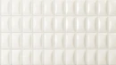 Biała płytka ścienna WOW 3DB Bevel Quartz Gloss 12,5x25 cm (135547) o błyszczącym wykończeniu i trójwymiarowej, wypukłej strukturze z fazowanymi krawędziami. Prostokątne kafelki ułożone w regularny wzór tworzą subtelną grę światła i cienia.