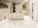 Emil/Ergon Ceramica Matera Stone Sassi White Silktech Rett. 60x120 EN4Y beżowa gresowa płytka imitująca lastryko z dużymi oczkami na ścianach i podłodze nowoczesnej kuchni. Wyspa kuchenna, czarna armatura kuchenna.