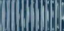 Granatowa, błyszcząca płytka ścienna WOW Colour Notes Bars Indigo Gloss 4x12,5 cm 133162. Ceramika dekoracyjna o wypukłej, trójwymiarowej strukturze z pionowymi paskami w głębokim odcieniu indygo.