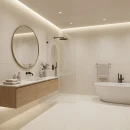 Beżowa łazienka z płytkami imitującymi beton Cifre Acron Ivory Mate N-Plus SI Rect. 90x90, ze strefą prysznicową typu walk-in ze szklaną szybą, wolnostojącą owalną białą wanną, okrągłym lustrem w mosiężnej ramie, oświetleniem LED przy suficie.